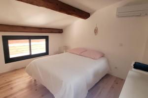 Giường trong phòng chung tại La Gruissanaise