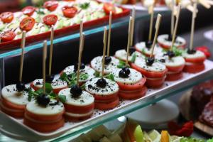 a bunch of food on display in a display case at Arena Mar Hotel and SPA in Golden Sands