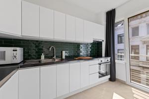 Η κουζίνα ή μικρή κουζίνα στο Central & luminous apartment