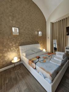 a bedroom with a large bed in a room at Napoli the charme in Naples