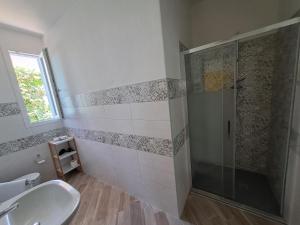 a bathroom with a shower and a sink at I Sette Ulivi Bed and Breakfast in Tergu +46 photos