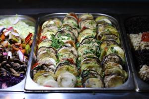 a tray of food with sushi and other foods at Arena Mar Hotel and SPA in Golden Sands