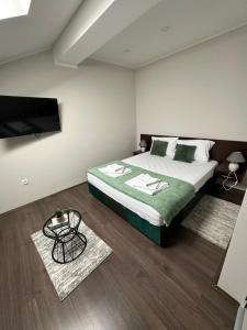Postel nebo postele na pokoji v ubytování Fenix Apartments