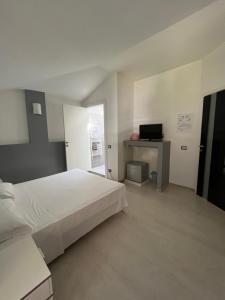 Postel nebo postele na pokoji v ubytování Bella Vita Guesthouse -parcheggio privato interno