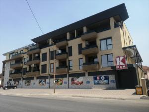 an apartment building on the corner of a street at Bukefal apartment in Skopje
