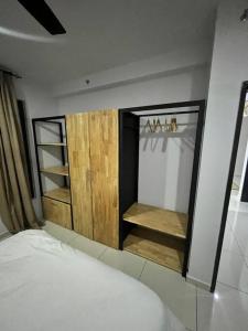 Postel nebo postele na pokoji v ubytování Mus lim Homestay Gaia Residence, Rawang