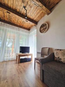 TV a/nebo společenská místnost v ubytování Dunaparti Vendégház