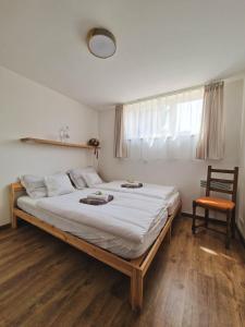 Postel nebo postele na pokoji v ubytování Dunaparti Vendégház