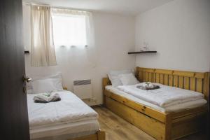 Postel nebo postele na pokoji v ubytování Dunaparti Vendégház