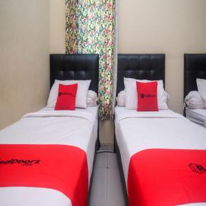 Letto o letti in una camera di RedDoorz Plus @ Timoho