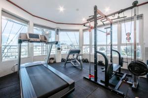 a gym with a treadmill and exercise equipment in a building at A25 Hotel - 185-187 Lò Đúc in Hanoi