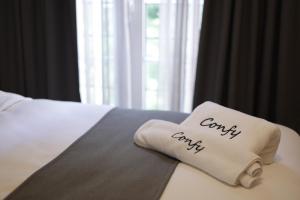 Postel nebo postele na pokoji v ubytování Comfy apart hotel