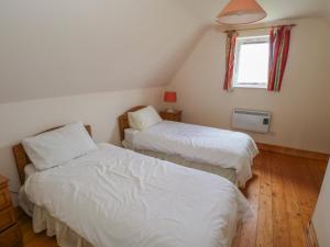 Voodi või voodid majutusasutuse No 3 Beach Cottages toas