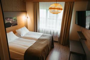Ένα ή περισσότερα κρεβάτια σε δωμάτιο στο Hotel Vík í Mýrdal