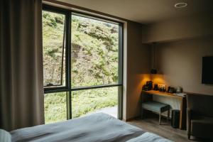 Ένα ή περισσότερα κρεβάτια σε δωμάτιο στο Hotel Vík í Mýrdal
