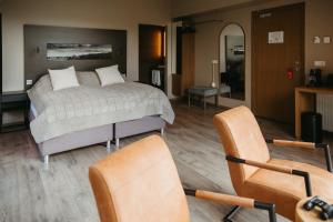 Ένα ή περισσότερα κρεβάτια σε δωμάτιο στο Hotel Vík í Mýrdal