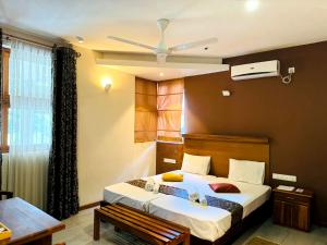 Postel nebo postele na pokoji v ubytování Rivorich Residence Kandy + 37 fotografií