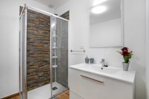 a white bathroom with a sink and a shower at Casa Rural tacoronte in Tacoronte +21 photos