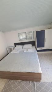 a bedroom with a large bed in a room at Vojinovic Apartments in Budva