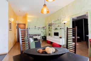 a living room with a table and some shelves at Casa moderna vicino Firenze in Prato +6 photos