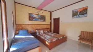 Postel nebo postele na pokoji v ubytování Berliant Homestay + 6 fotografií