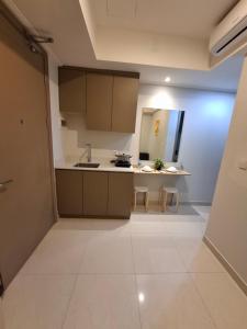 a small kitchen with a sink and a counter at New! 1 bedroom Gold coast Pik Honolulu tower in Jakarta