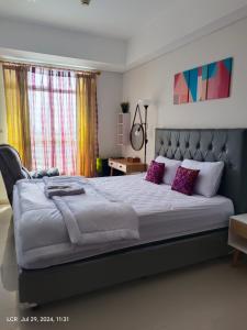 Giường trong phòng chung tại 1BR new apartment at Borneo Bay City Balikpapan