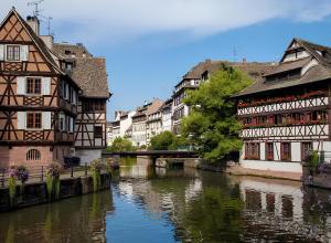 a group of buildings next to a river at Parenthèse Alsacienne in Schiltigheim