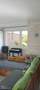 Postel nebo postele na pokoji v ubytování Gite HELSEBAN - Maison à 3 minutes de la mer dans résidence privée