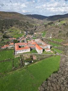 an aerial view of a town in the hills at A Quinta de Cea - Apartamentos in Cea