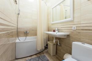 a bathroom with a shower and a sink and a toilet at "Wine palette" on Skovoroda Street, 56 in Kharkiv +49 photos