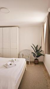 Guesthouse Augusta Insula客房内的一张或多张床位