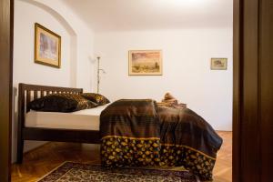 a bedroom with a bed with two pillows at Apartment Ztracená 8 in Olomouc