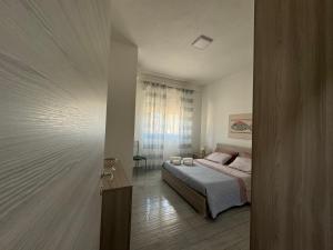 Posteľ alebo postele v izbe v ubytovaní Casa Gio - Appartamenti Vacanze
