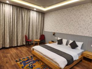 a bedroom with a large bed in a room at The Clove Ladakh in Leh +127 photos
