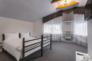 Postel nebo postele na pokoji v ubytování Eden 7 + 7 fotografií