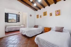Postel nebo postele na pokoji v ubytování Finca Monte Cielo + 28 fotografií
