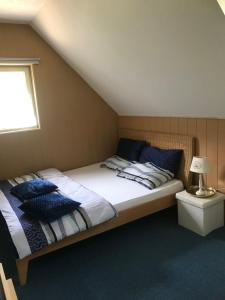 Postel nebo postele na pokoji v ubytování Haus Almblick