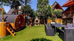 Vonkajšia záhrada v ubytovaní Aparthotel Delta Zakopane