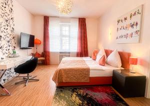 TV a/nebo společenská místnost v ubytování Hotel Service Apartments am Prinzenplatz - Superior