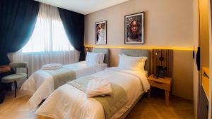 Postel nebo postele na pokoji v ubytování Elite View Hotel Dakhla