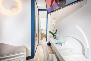 Koupelna v ubytování Hotel Karinzia + 37 fotografií