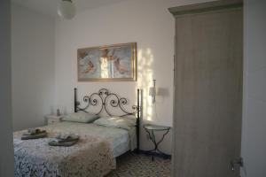 Postel nebo postele na pokoji v ubytování B&B La Marinella