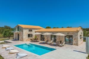 a villa with a swimming pool and a house at Villa Nava - Nestled in Olive Trees with Private Pool, by ZanteWize in Alykes +64 photos