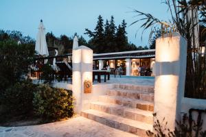 a set of stairs leading up to a house at Can Vistabella Boutique Resort in San Antonio