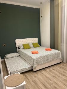 En eller flere senge i et værelse på Casa Rebocco