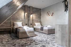 Postel nebo postele na pokoji v ubytování RCR Einstein studios 2 + 165 fotografií