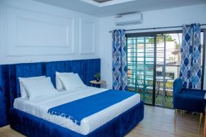 Ένα ή περισσότερα κρεβάτια σε δωμάτιο στο La Haussmannienne Place