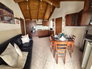 a living room with a table and a couch at Nonnos panorama in Nizza Monferrato