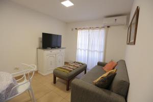 a living room with a couch and a chair at M. BERNARD in Concordia